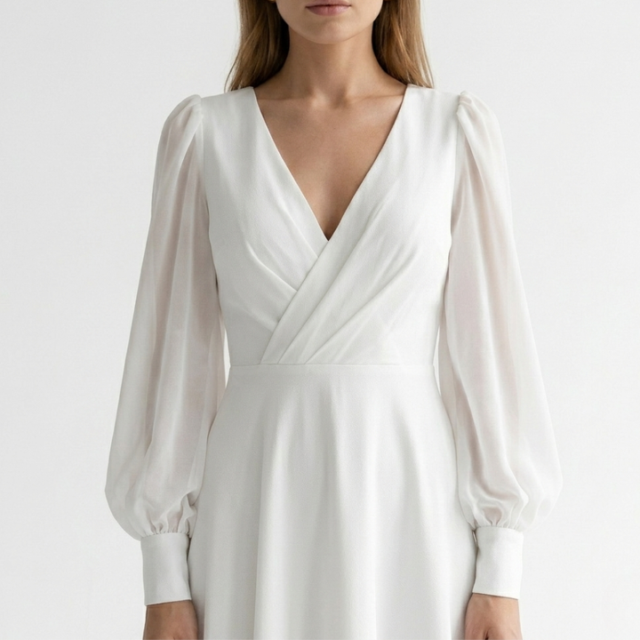 Versatile women's white V-neck wrap midi dress with a flared hem, ideal for elegant occasion wear.