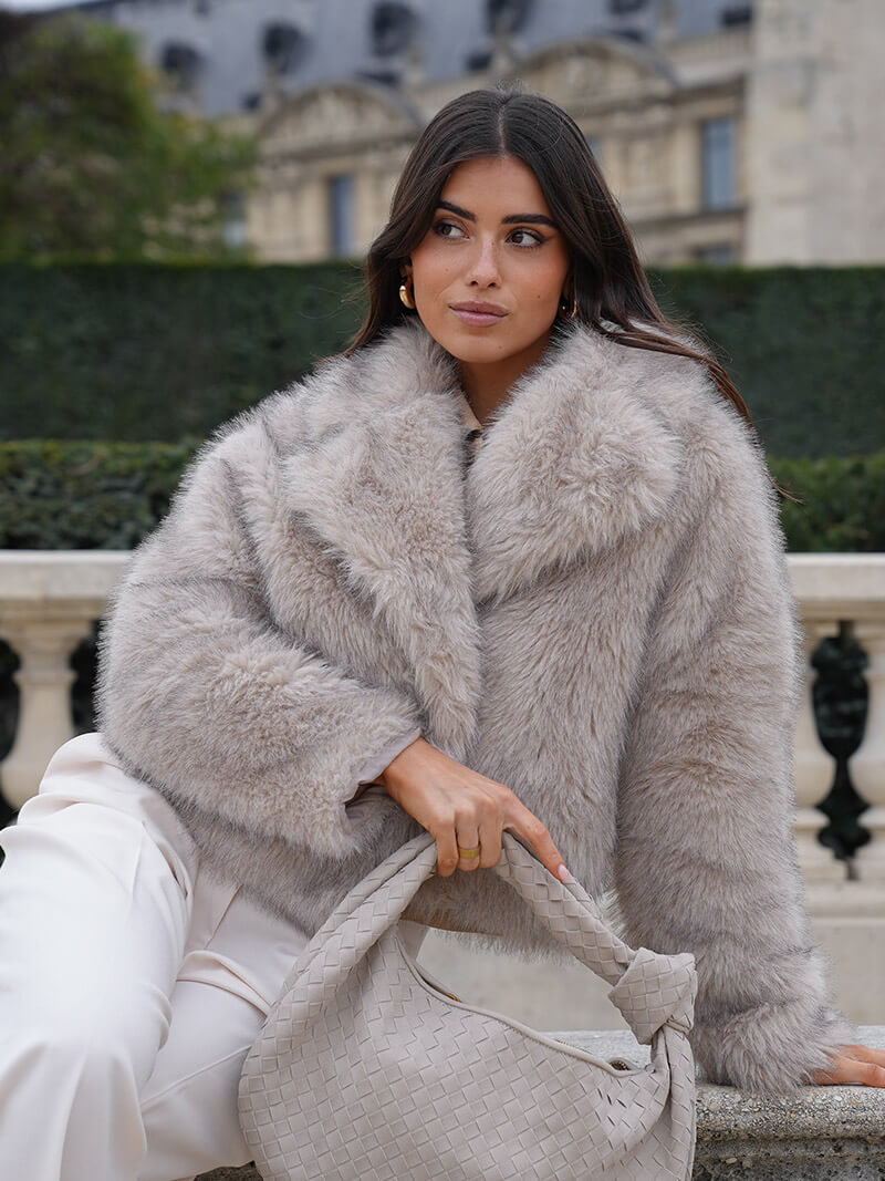 Stay warm in this elegant women's wide lapel winter coat. A timeless classic style for cold weather comfort.