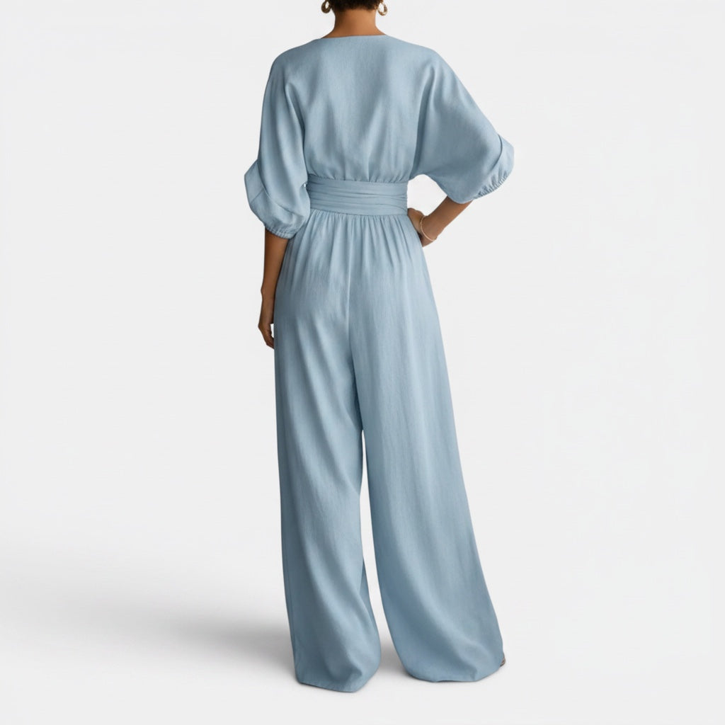 Sophisticated women's wide-leg jumpsuit dress. Ideal elegant event outfit, combining comfort with modern style.