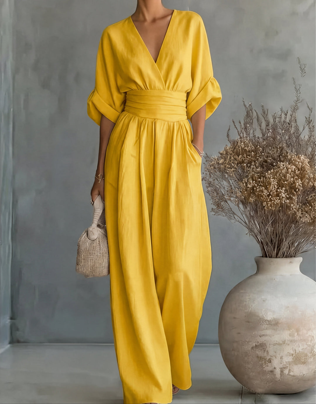 Elegant deep-hued wide-leg jumpsuit for women, perfect for evening wear.