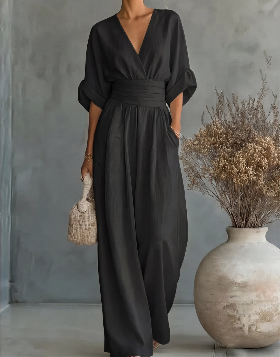 Woman showcasing the movement of a versatile wide-leg jumpsuit, casual yet chic.