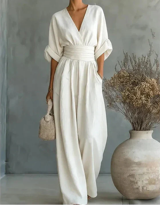 Sophisticated women's wide-leg jumpsuit, featuring a flattering wrap design for effortless style.