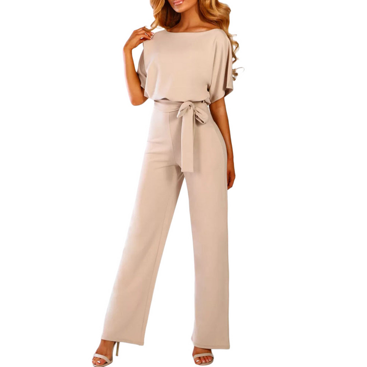 Stylish women's jumpsuit featuring a flattering wide leg silhouette and delicate flutter sleeves.