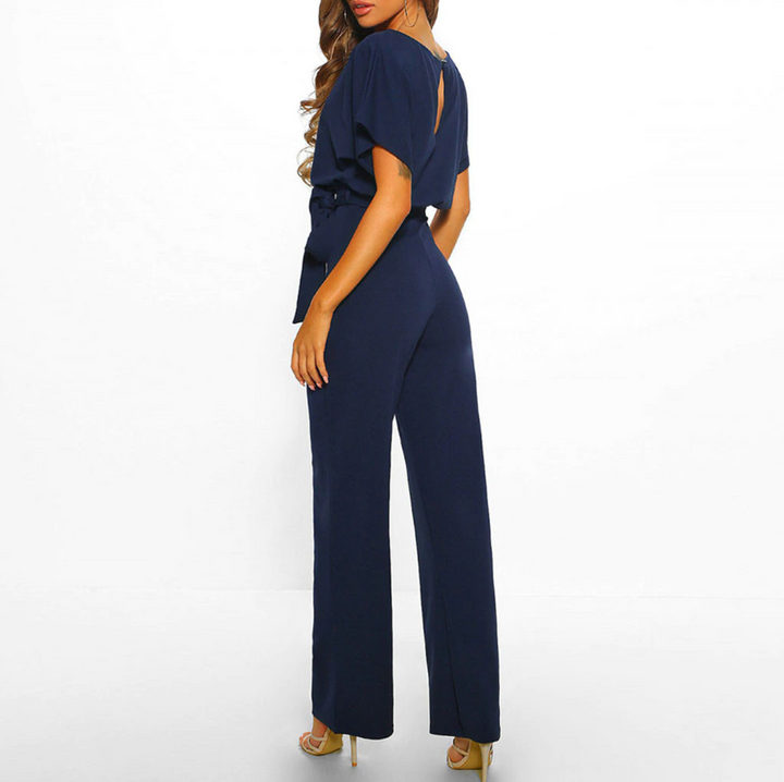 Elevate your style with this women's wide leg jumpsuit, featuring stylish flutter sleeves.