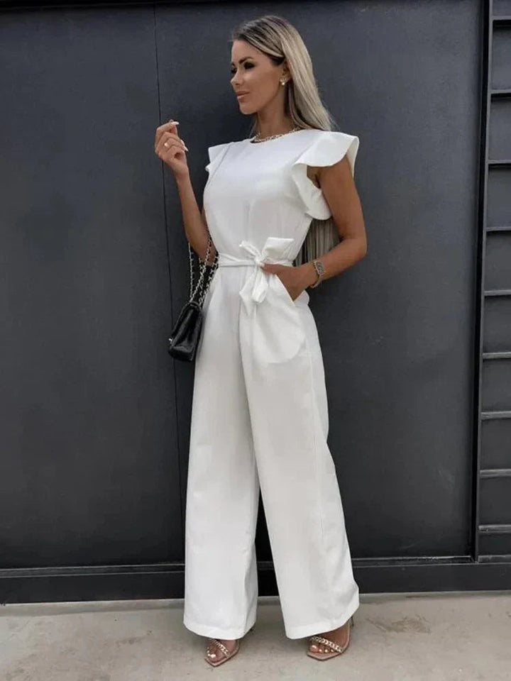 Chic women's wide leg jumpsuit with tie waist & pretty ruffle sleeves, ideal for summer outfits and casual style.