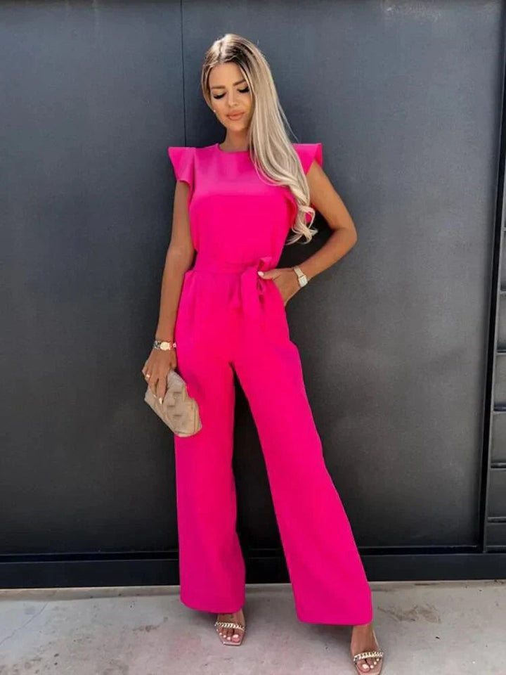 Fashionable women's wide leg jumpsuit. Features a flattering tie waist & elegant ruffle sleeves. Great for spring/summer.