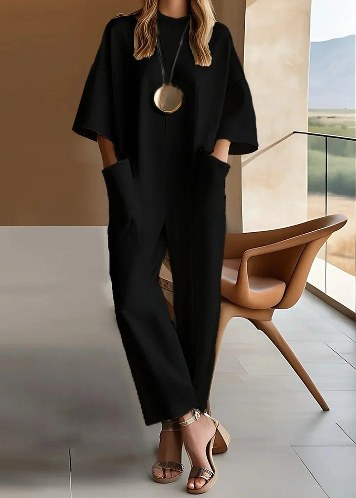 Stylish women's wide sleeve jumpsuit featuring a relaxed fit and functional pockets, perfect for versatile summer fashion.