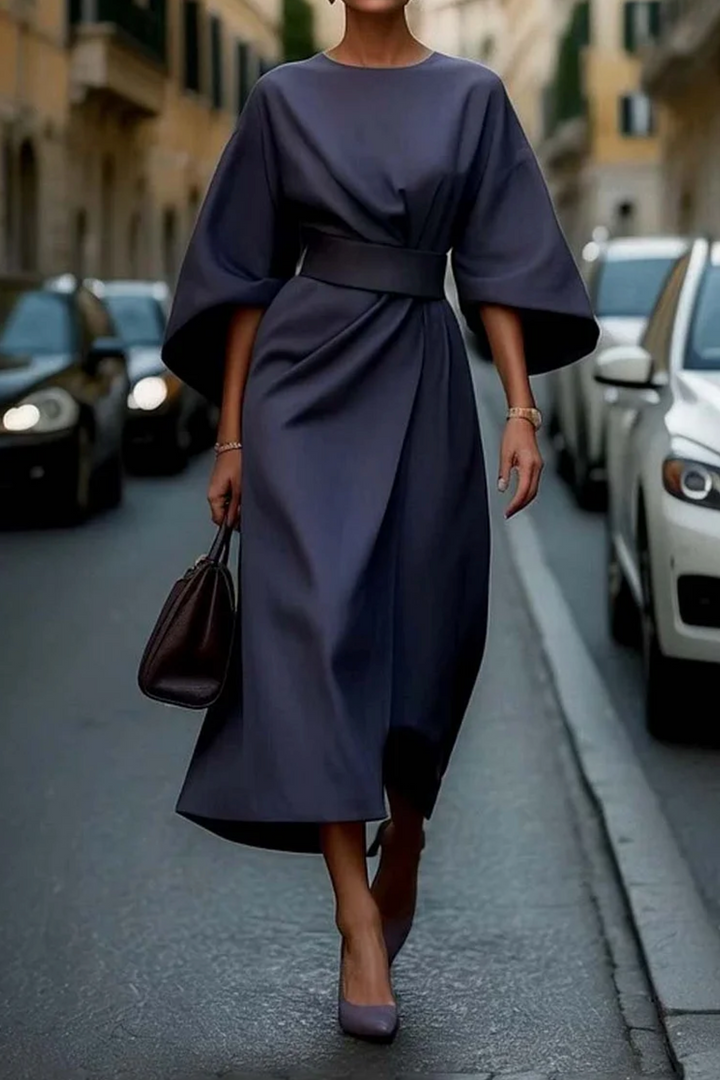 Chic women's belted midi dress, featuring stylish wide sleeves and a comfortable round neck. Ideal for summer.