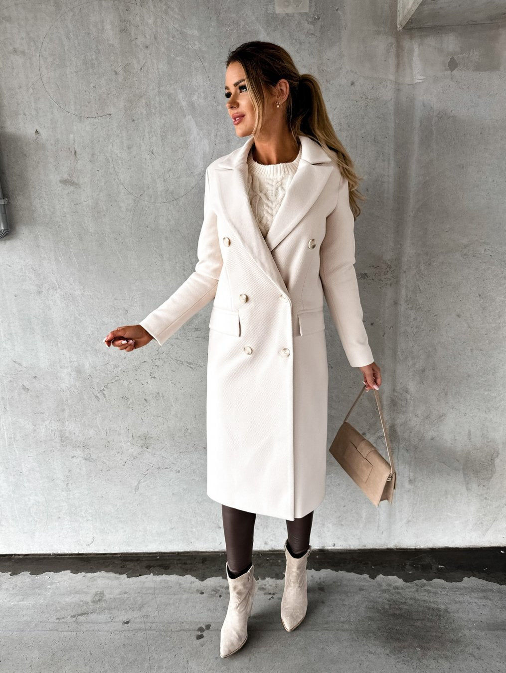 Stylish women's apricot winter coat. Warm long-sleeve outerwear for elegant fashion and cold weather.