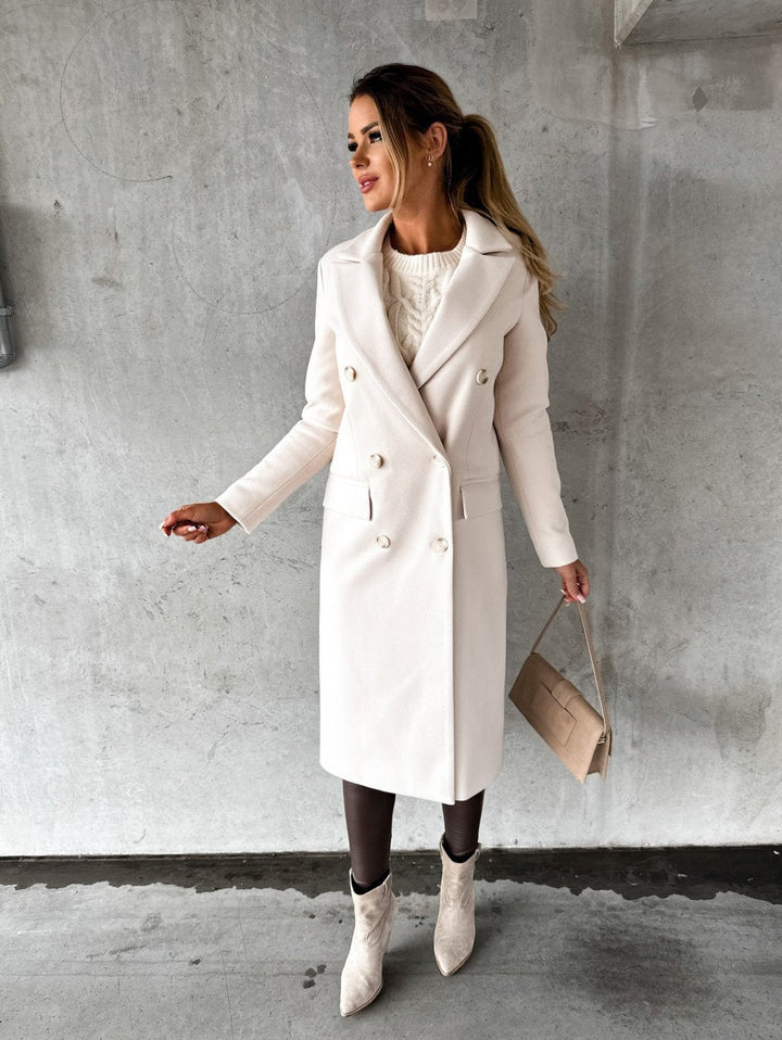 Stylish women's apricot winter coat. Warm long-sleeve outerwear for elegant fashion and cold weather.