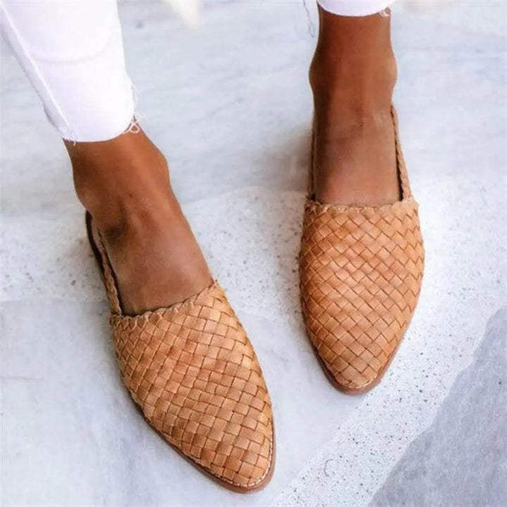 Light brown textured woven women's flats. Breathable slip-on comfort shoes for warm weather, elegant everyday style.