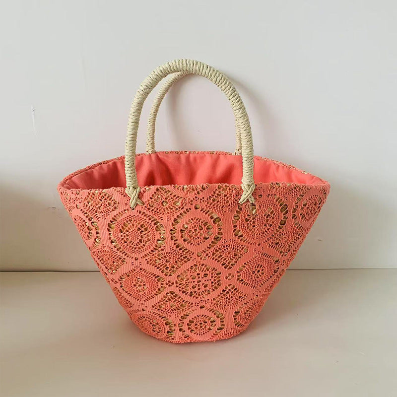 Stylish braided straw handbag for women, a summer essential chic accessory.