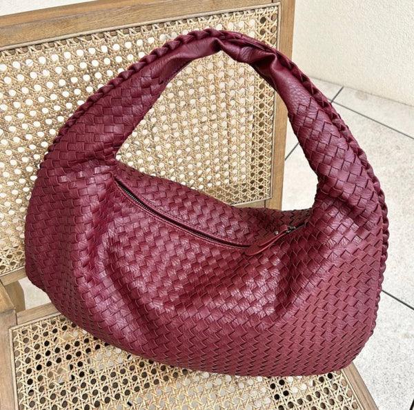 Soft vegan leather women's woven slouch bag, a fashionable and practical shoulder handbag for daily use.