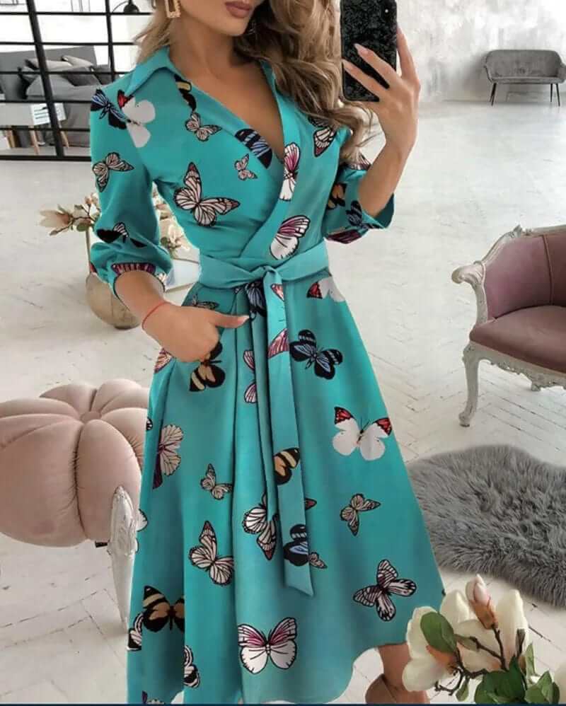 Elegant women's wrap midi dress, flattering design for versatile wear. Ideal for formal or casual occasions.