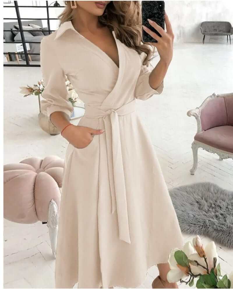 Stylish women's midi wrap dress featuring an elegant V-neck and waist tie. Flattering silhouette for all.