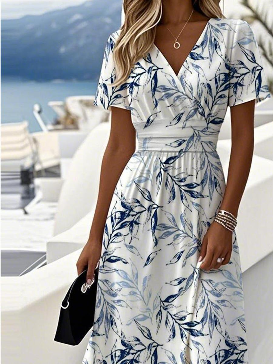 Flowy botanical leaf print V-neck wrap midi dress for women, ideal for smart casual spring and summer events.