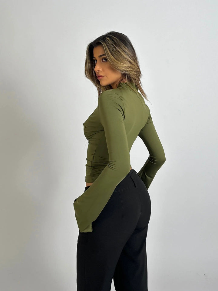 Feminine fitted wrap top for women, with elegant lace trim and a flattering deep V-neck.