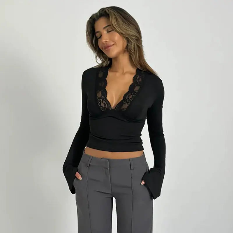 Luxurious women's elegant wrap top with V-neck and delicate lace trim, ideal for special evenings.