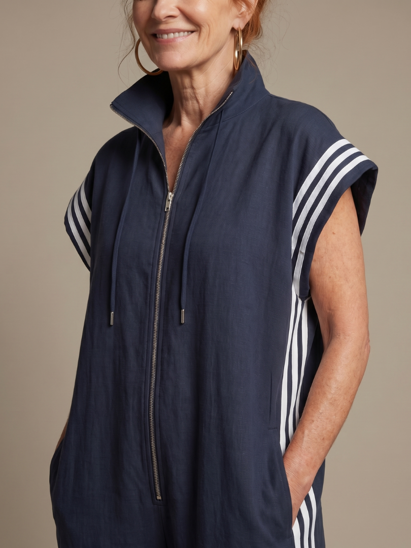 Elegant women's full-length jumpsuit featuring a cap sleeve, zip front, striped panels & wide leg.