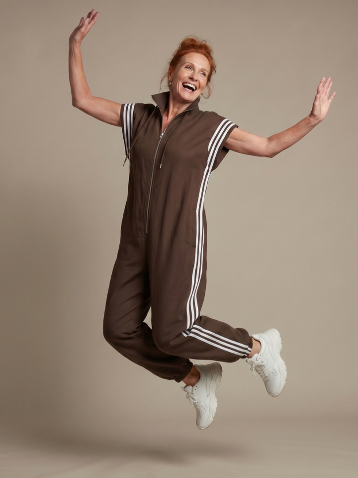 Chic women's casual jumpsuit, cap sleeve, zip front, striped panels, wide leg & comfortable fit.
