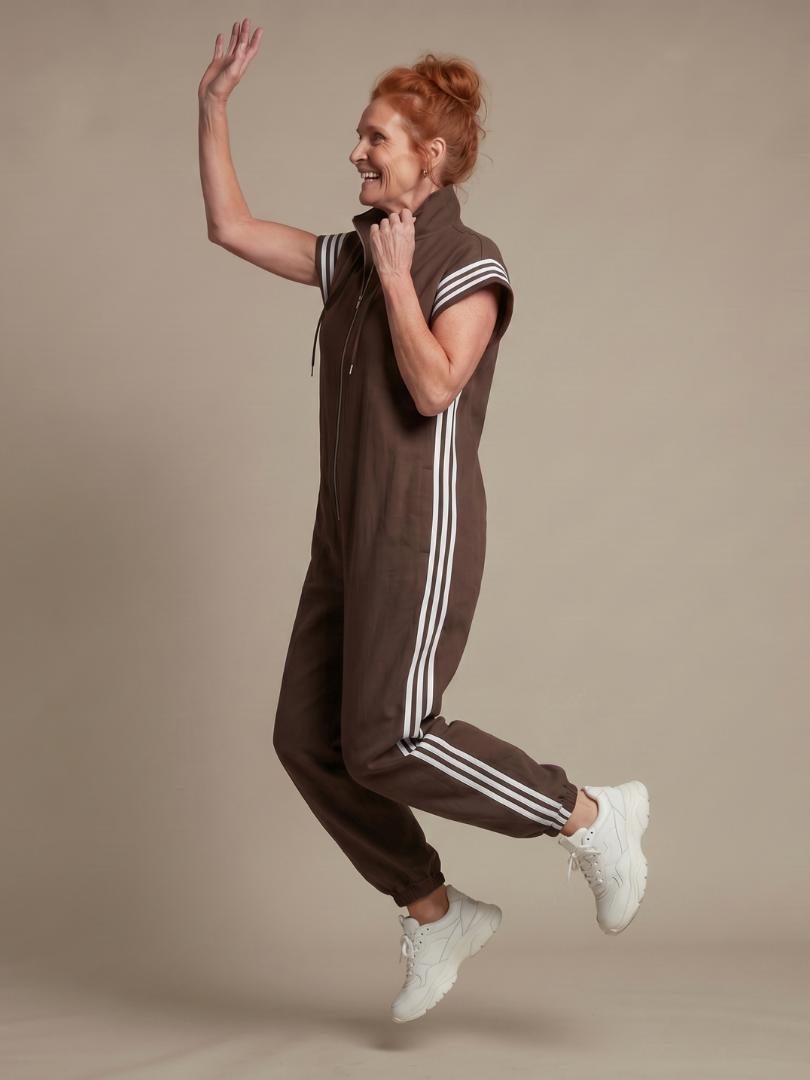 Elegant women's full-length jumpsuit with a zip front, striped panels & a fashionable wide leg.