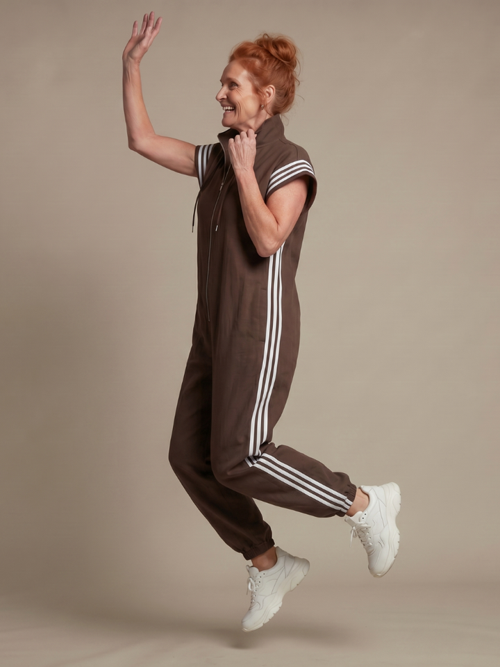 Elegant women's full-length jumpsuit with a zip front, striped panels & a fashionable wide leg.