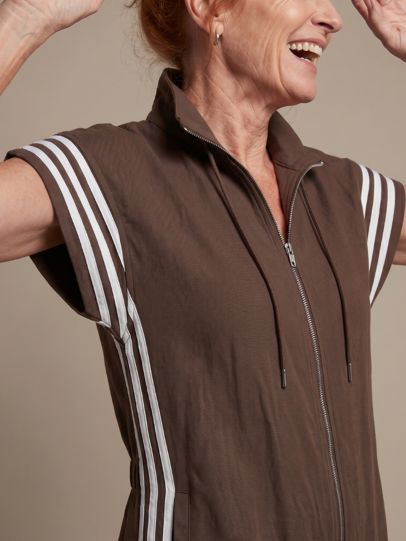 Women's trendy jumpsuit: relaxed fit, cap sleeve, zip front, striped panels & flowy wide leg.