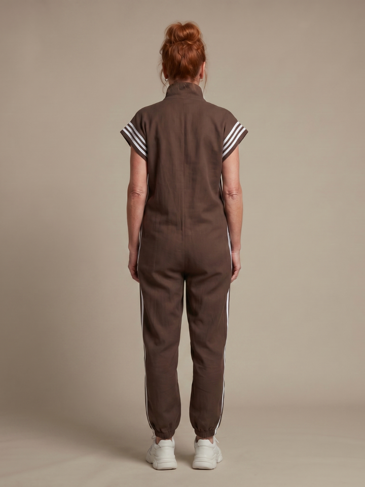 Stylish women's striped wide leg jumpsuit, zip front, cap sleeve, full length & elegant design.