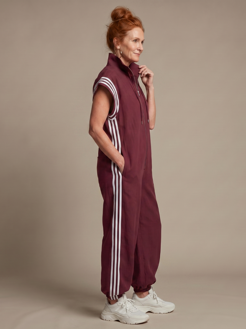 Women's fashion jumpsuit: chic zip front, striped panels, relaxed fit, cap sleeves & wide leg.
