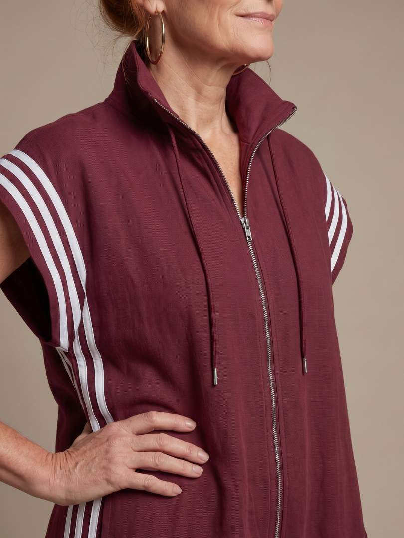 Stylish full-length women's jumpsuit featuring a zip front, elegant striped panels & wide leg.