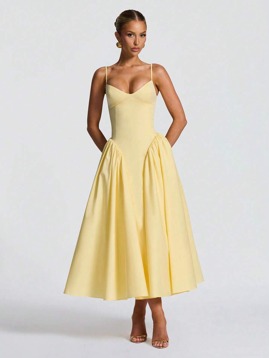 Elegant yellow A-line midi dress for women, perfect as a wedding guest or summer party dress. Formal occasion wear.