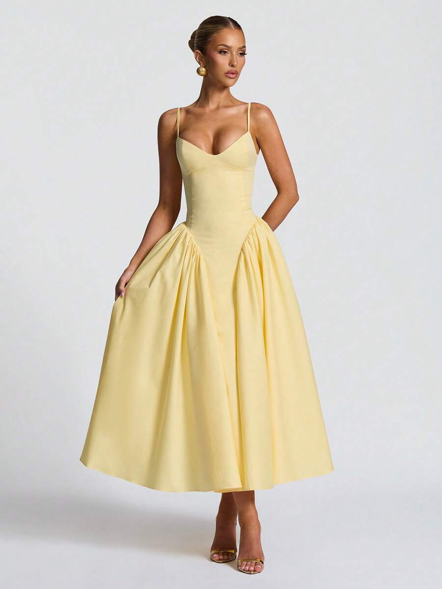 Stylish women's A-line midi dress in vibrant yellow, ideal for wedding guests & formal events. Flattering party wear.