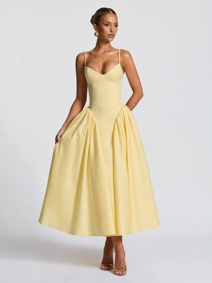 Stylish women's A-line midi dress in vibrant yellow, ideal for wedding guests & formal events. Flattering party wear.