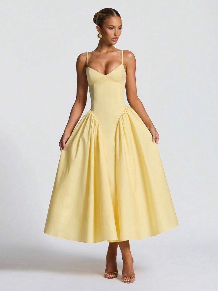 Beautiful yellow A-line midi dress for women. Versatile elegant occasion dress, great for summer weddings & parties.