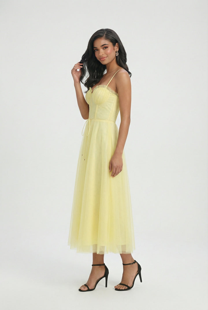 Elegant yellow corset midi dress with a flowing tulle skirt, perfect for summer occasions.