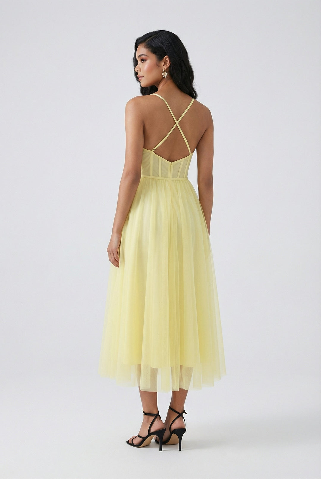 Stunning yellow occasion dress featuring a structured corset bodice and a graceful midi length.