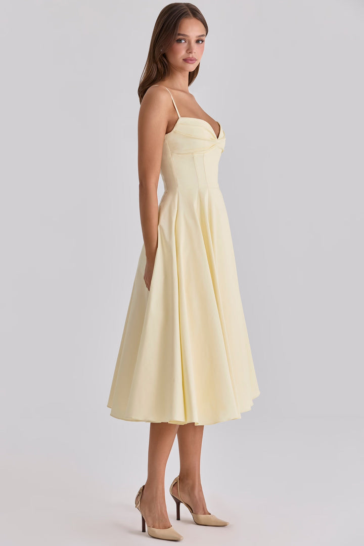 Stylish women's yellow gathered bust midi dress, a chic and elegant choice for summer outings and vacation fashion.