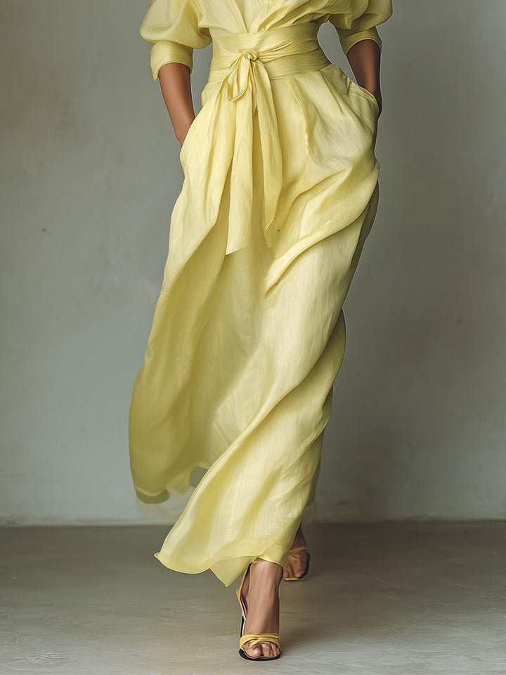 Elegant women's yellow tie-waist maxi shirt dress with half sleeves. A versatile, flowy casual summer day dress.