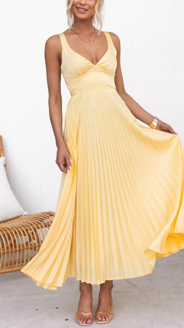 Elegant yellow pleated V-neck maxi dress for women, perfect for summer parties or wedding guests. Sleeveless & open back.