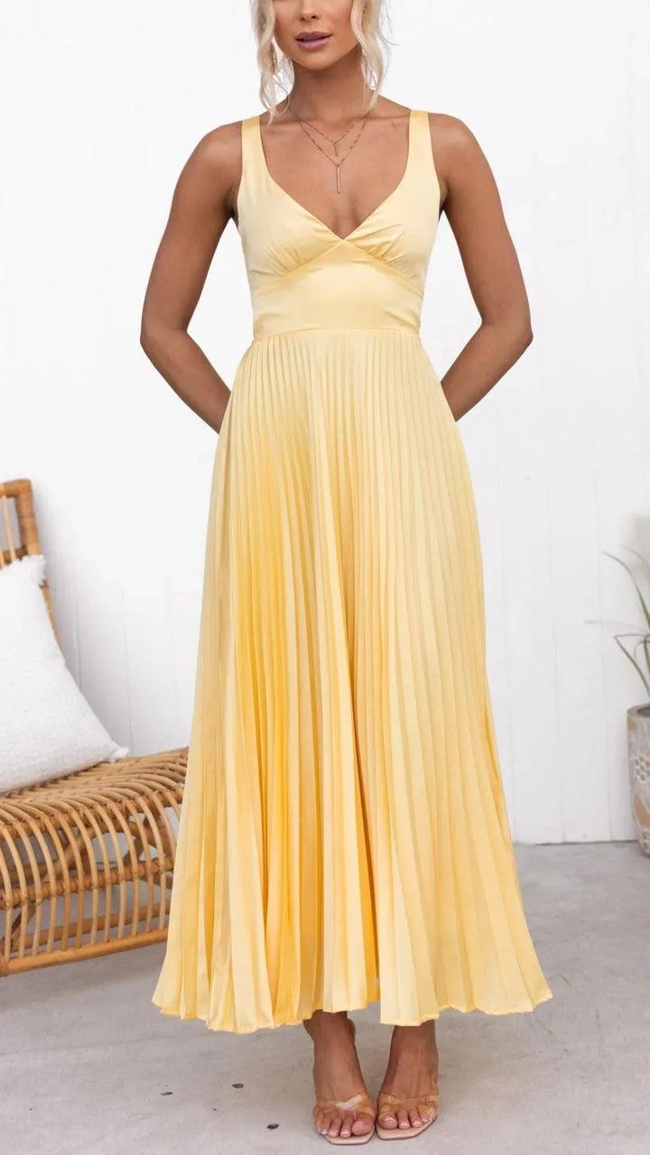 Vibrant yellow sleeveless maxi dress with elegant pleats & V-neck, ideal for sophisticated summer events.