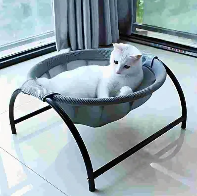 Modern elevated cat bed, a stylish pet furniture piece. Breathable hammock design offers cozy comfort for your cat.