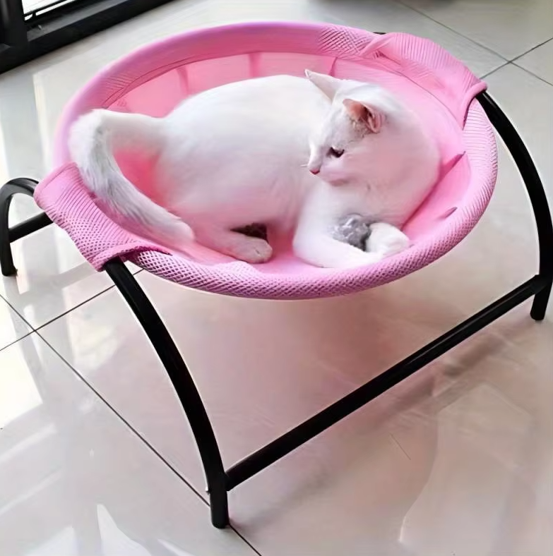 Sturdy elevated cat hammock bed with breathable fabric for superior cat comfort. A modern pet accessory for any home.