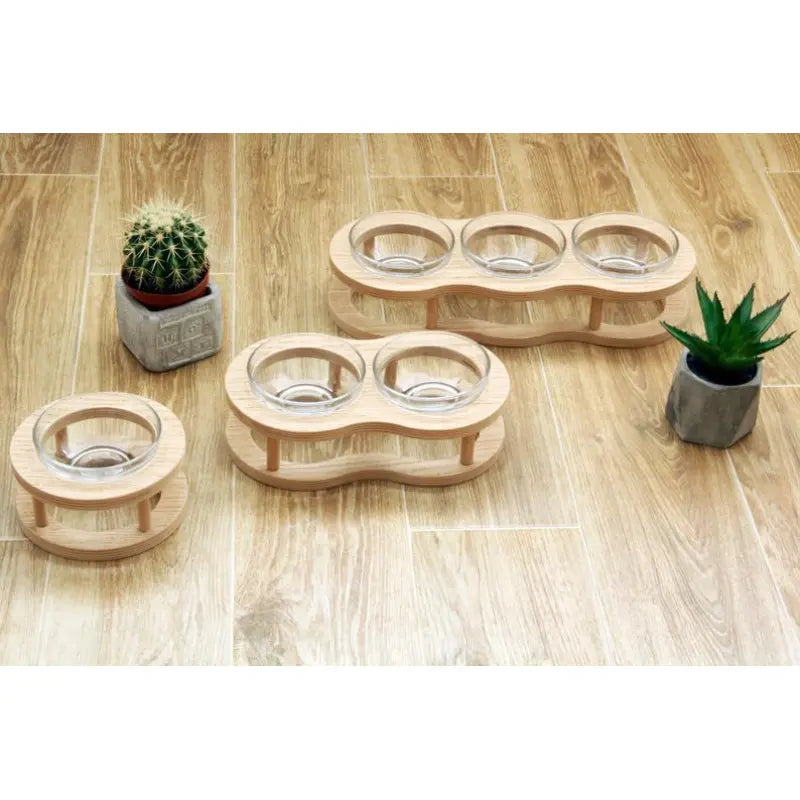 Raised wood & glass pet feeding bowl set promotes healthy posture; non-slip base for dogs & cats.