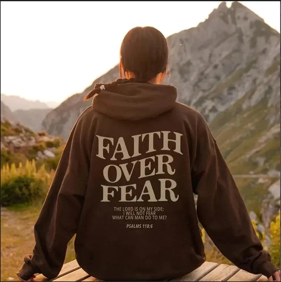 Empowering Women's Faith Over Fear graphic hoodie. Comfortable pullover, perfect for casual wear & streetwear.