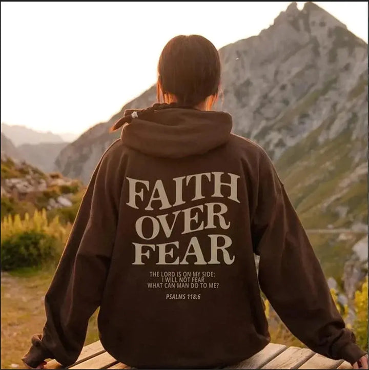 Empowering Women's Faith Over Fear graphic hoodie. Comfortable pullover, perfect for casual wear & streetwear.