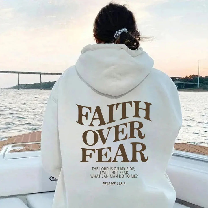Statement piece: Women's Faith Over Fear graphic hoodie. Empowering, motivational & stylish spiritual apparel.