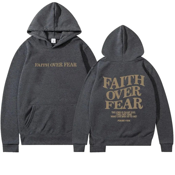 Close-up of 'Faith Over Fear' graphic on women's hoodie. Inspirational streetwear with empowering message.