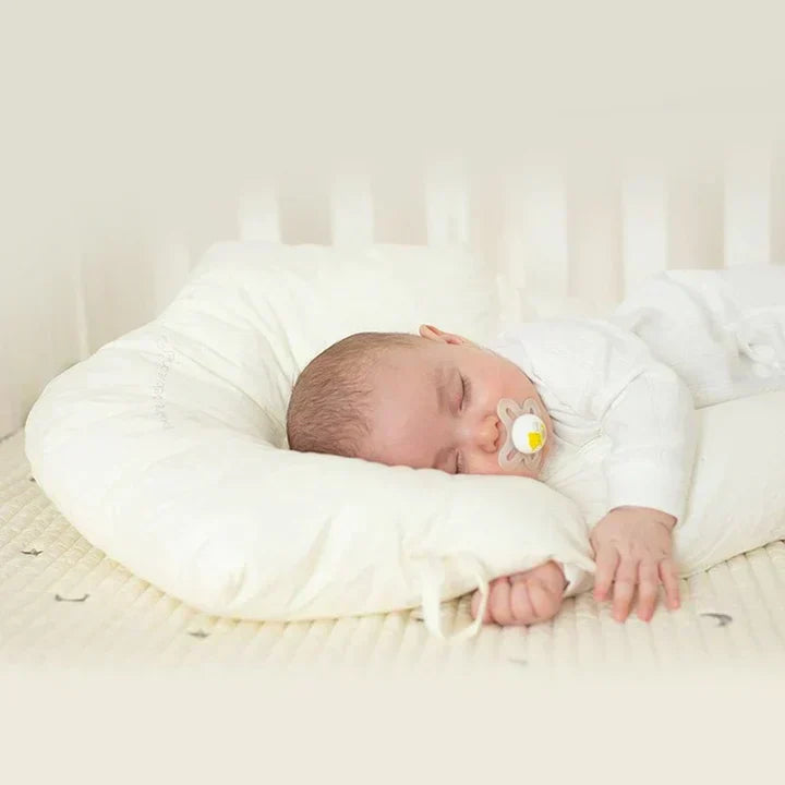Newborn essential: ergonomic baby sleep cushion offering safe, antibacterial comfort.