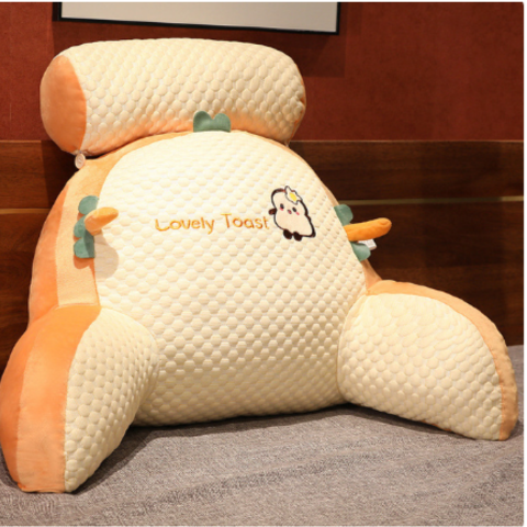 Plush back support pillow in a cozy living room setting, featuring a washable cover & ergonomic design.