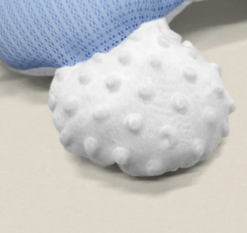 Breathable infant cuddle nest, perfect for newborn support and a cozy sleep environment.